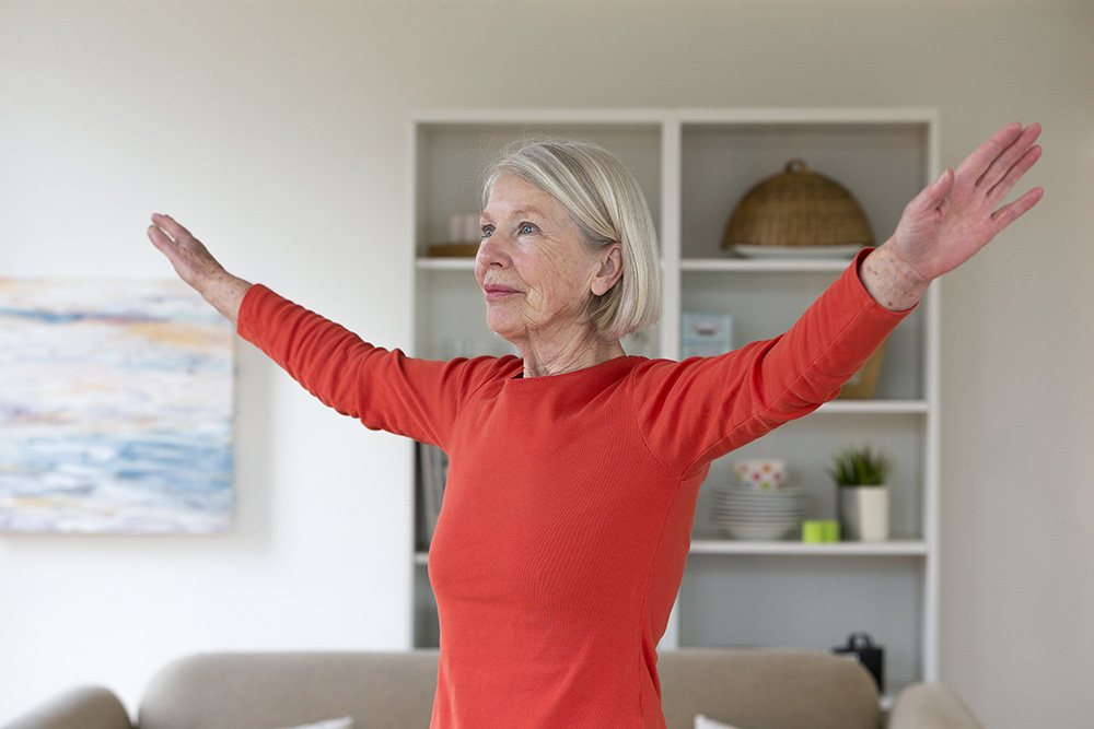 Senior woman exercising at home